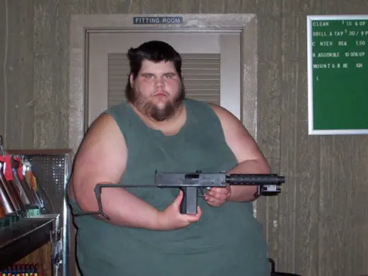  Fat Guy Shows Off Gun
