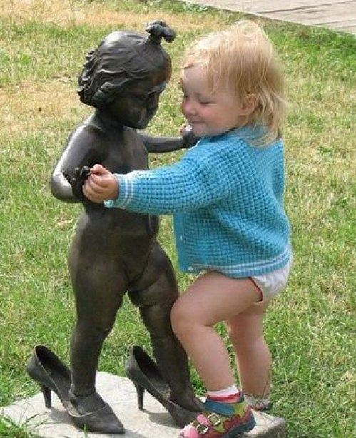 Playing With Statue